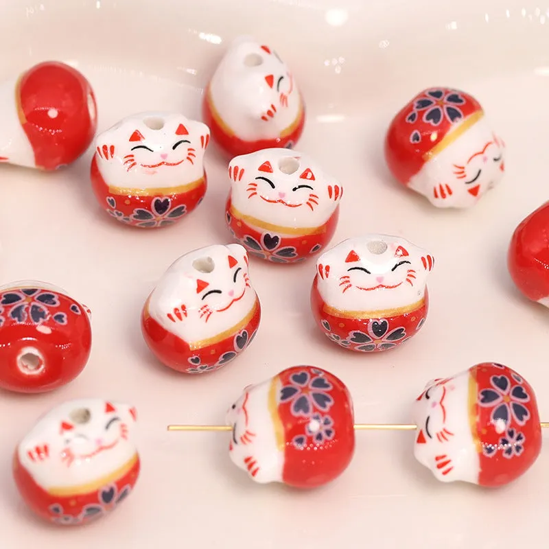 La Petite Epicerie Maneki Neko kraal rood 13x14 mm porselein